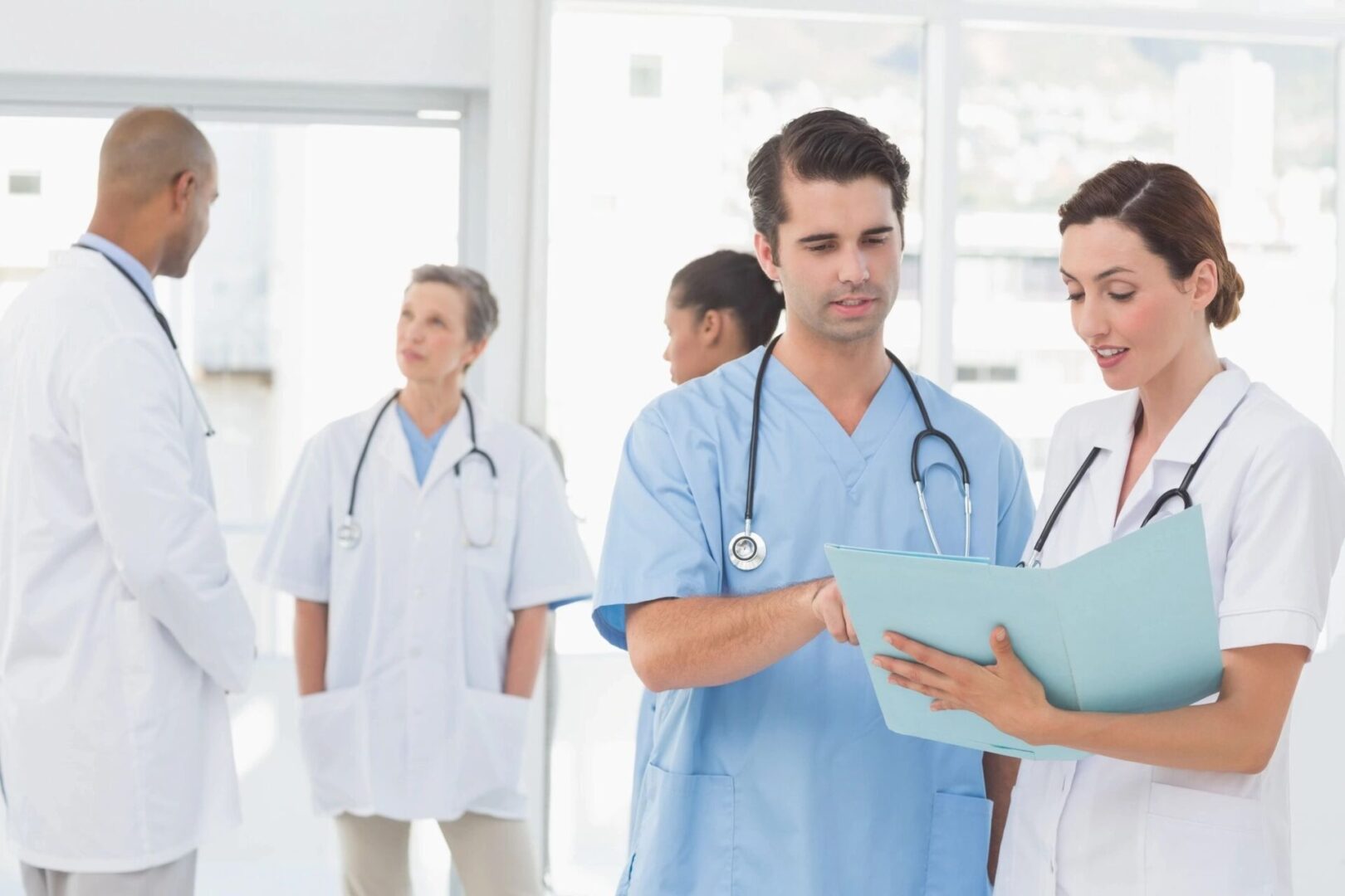 A group of doctors standing in front of each other.